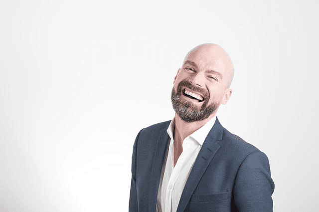 Hair Loss with Hypothyroidism: Bald man laughing